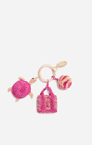 Pink raphia turtle charm