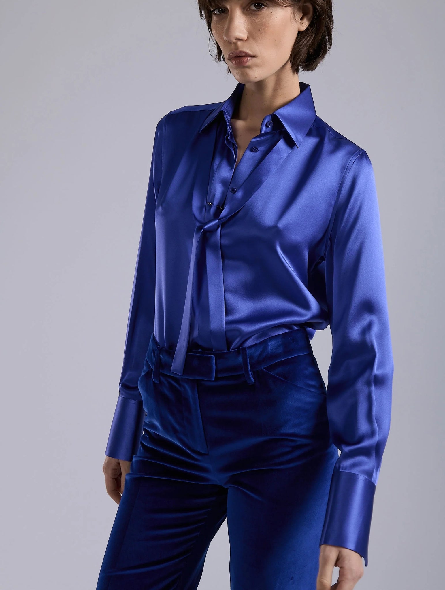 Blue silk blouse, piercing