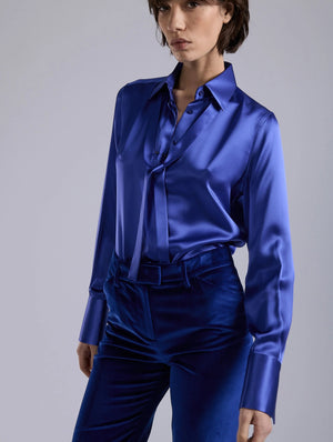 Blue silk blouse, piercing