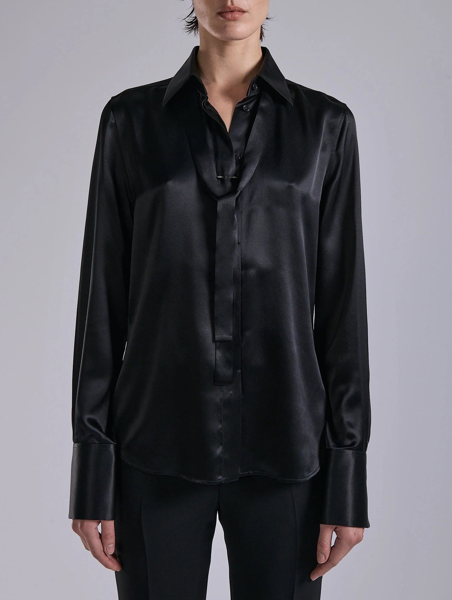 Black silk blouse, piercing
