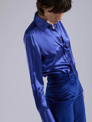 Blue silk blouse, piercing